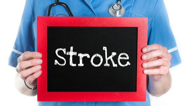 a sign with the word stroke on it being held by a clinician