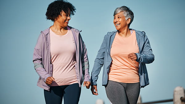 Two ladies walking and talking