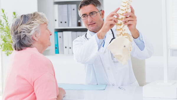 A doctor is talking with a female patient.