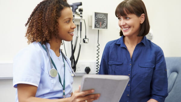 A doctor is talking with a female patient.