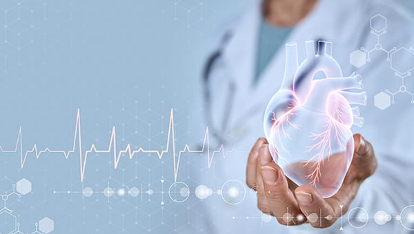 A doctor holding his hand out with a drawing of a heart in his hand