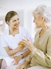 Nurse handing an elderly woman a prescription 