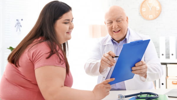 female patient speaking with a medical provider