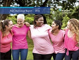 Five happy women wearing pink with arms interlocking around each other at the shoulders 