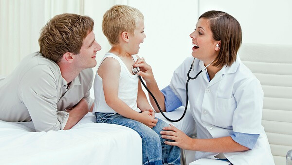 Doctor with boy and his father