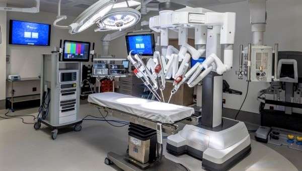 da vinci robot or2 inside of operating room with monitors and equipment