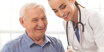 A male patient talks with a female doctor