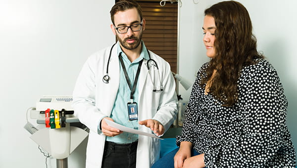 A patient having a consulative visit with their healthcare provider