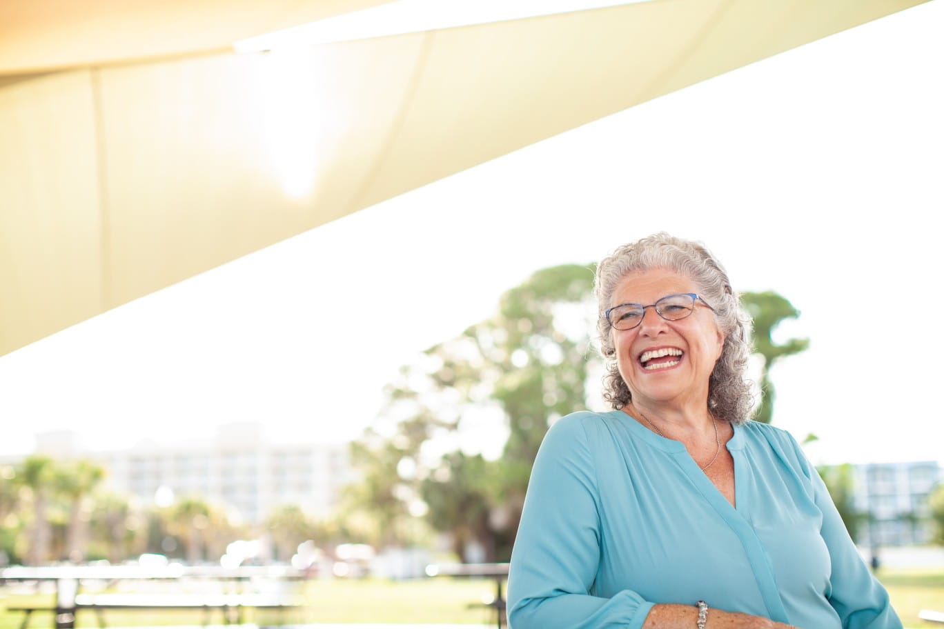 Senior woman outside and smiling towards the camera