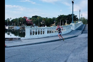 A triathlete runs on a bridge during the St Anthony's Triathlon in St. Petersburg