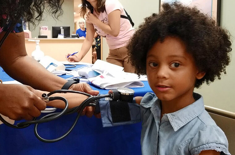  A child wears a blood pressure cuff