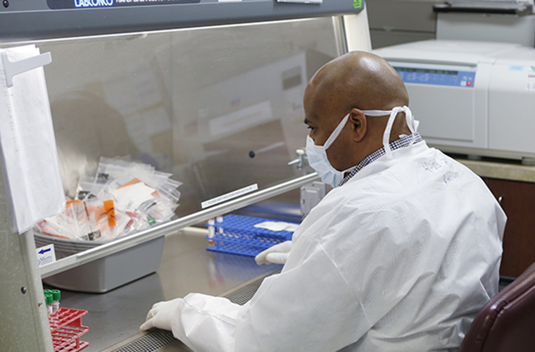 A BayCare laboratory team member conducts a test.
