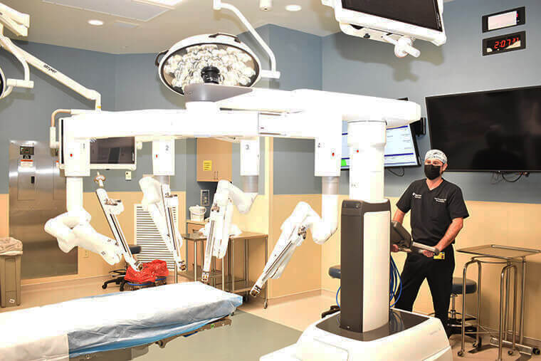 Dr. Brett Armstrong operates the da Vinci Xi surgical robot