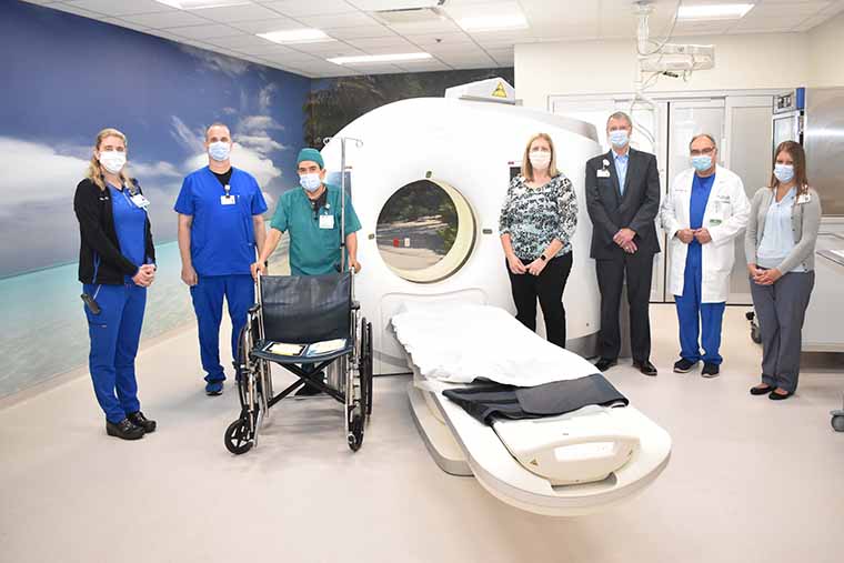 Cristian Rivas with St. Joseph's Hospital-North and BayCare representatives in a St. Joseph's Hospital-North ER imaging room