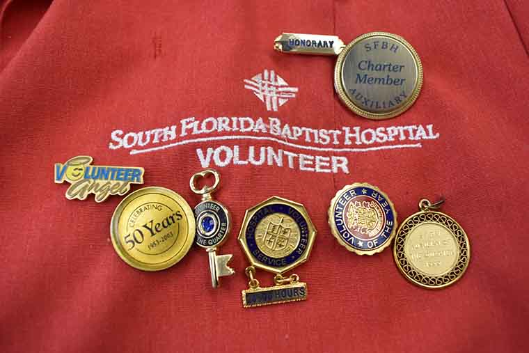 Flare pins on Dottie Pollock's volunteer coat