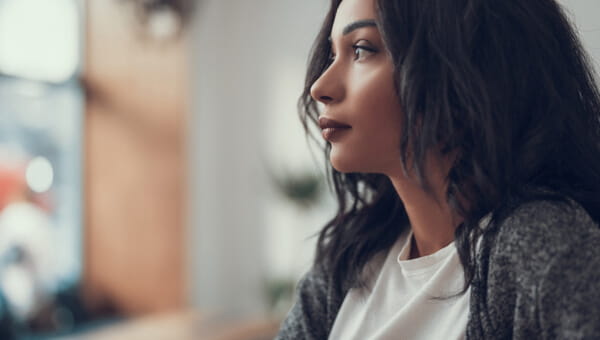 woman looking concerned toward something off screen