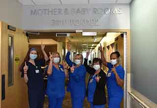 Some members of the Mom & Baby unit celebrate with the #1 symbol.
