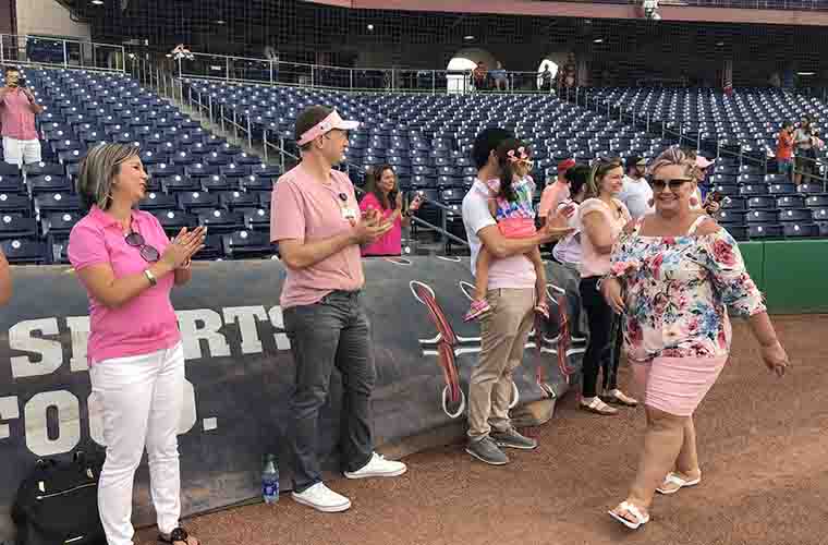 Racine mom, breast cancer survivor throws first pitch at Brewers