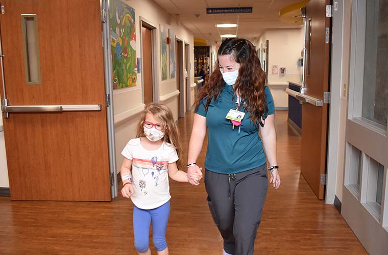 BayCare Child Life Specialist Brianna Wagner with 6-year-old pediatric patient.