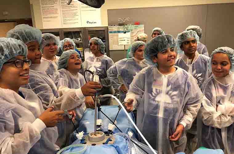 Students had fun taking turns in a mock laparoscopic procedure during the OR session.