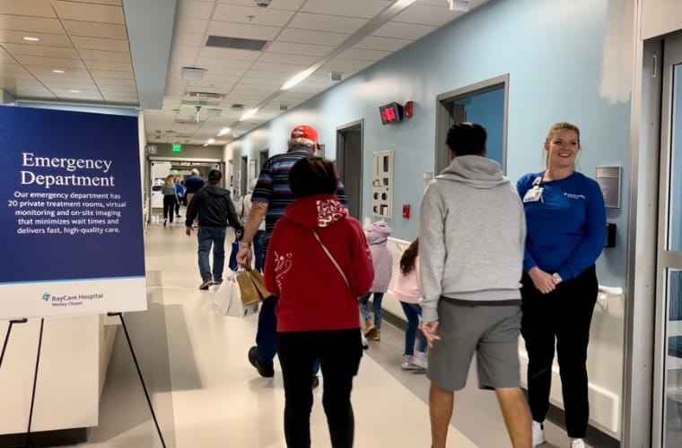 Community members walking through BayCare Hospital Wesley Chapel emergency department on a self-guided tour.