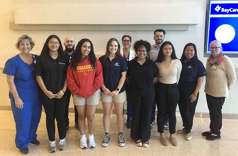 A group including students, BayCare team members and representatives from the Boys & Girls Club of the Suncoast meet during a recent orientation session.  