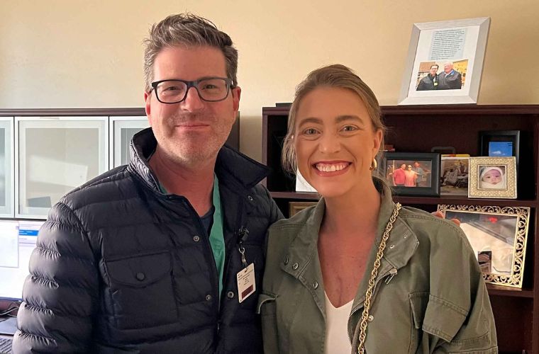 Brittany and Dr. Sherman photographed in a physician office together.