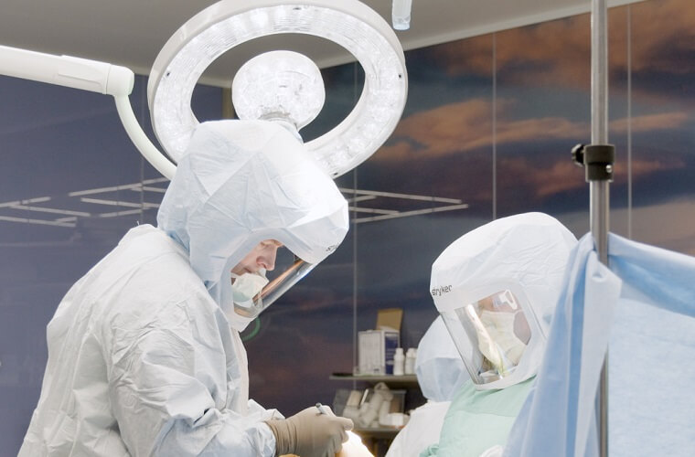 A surgeon operates on a patient at St. Anthony's Hospital in St. Petersburg.