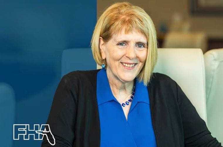 Gail Ryder of BayCare smiles while seated in a light-colored chair.The Florida Hospital Association (FHA) logo appears in the lower left corner.