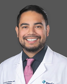 Dr. Martin Molina's Headshot wearing a lab coat 