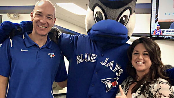 Dr. Farrar and Ms. Dailey pose with the Dunedin Blue Jays mascot.