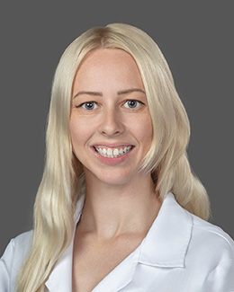 Dr. Rachel Utter's headshot wearing a lab coat
