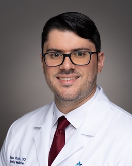 Dr. Blas Prieto's headshot wearing a lab coat