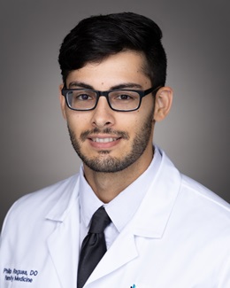 Dr. Philip Ragusa's headshot wearing a lab coat 