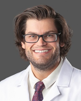 Dr. Jared Larkin's headshot wearing a lab coat 