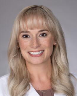 Headshot of Dr. Collins wearing lab coat 