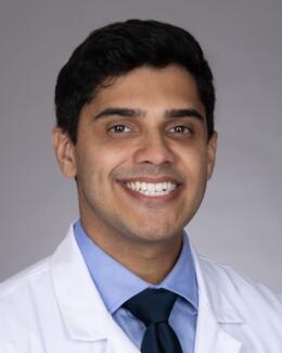 Headshot of Dr. Knight wearing a lab coat