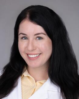 Headshot of Dr. McCann wearing a lab coat