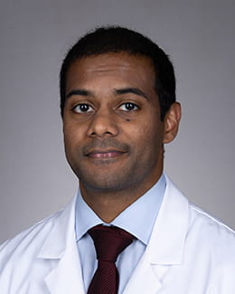 Vishaak Kondoor's headshot in a lab coat