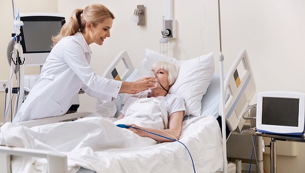 Respiratory therapist working with a patient