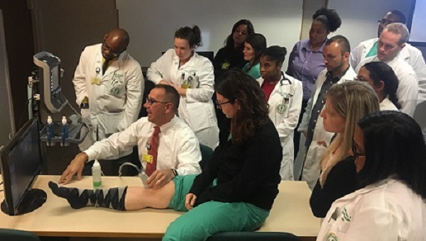 A group of BayCare medical residents observing patient care.