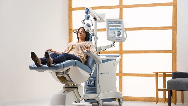 a female patient using the neurostar tms therapy system