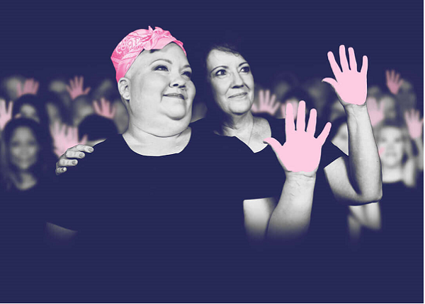 two women with pink hands and black shirts 