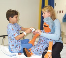 child life specialist working with pediatric patient