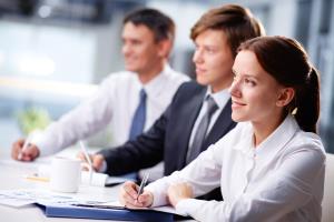 male and female professions sitting in a meeting