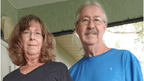 happy couple on their front porch