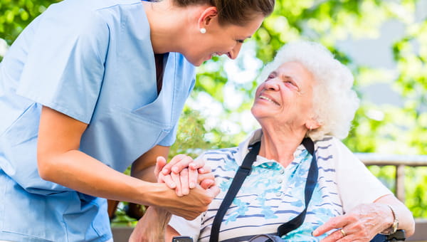 female nurse with elderly female patient