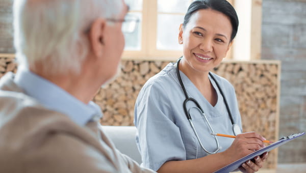 Man talking to female nurse