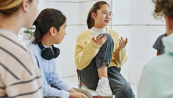 Group of teens talking.