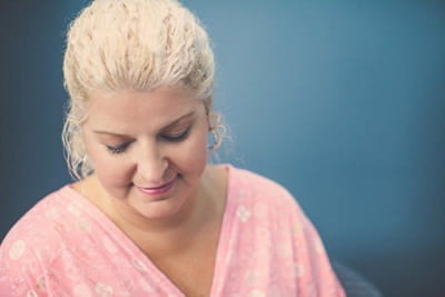 female patient in pink hospital gown